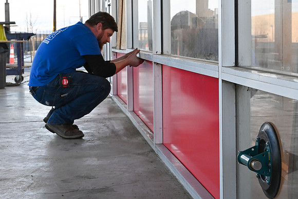 Pression glass installing pannels on front building
