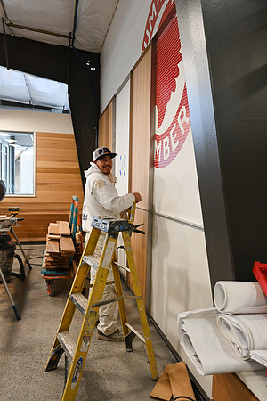 Sheets painting  working on the back wall to the front counter